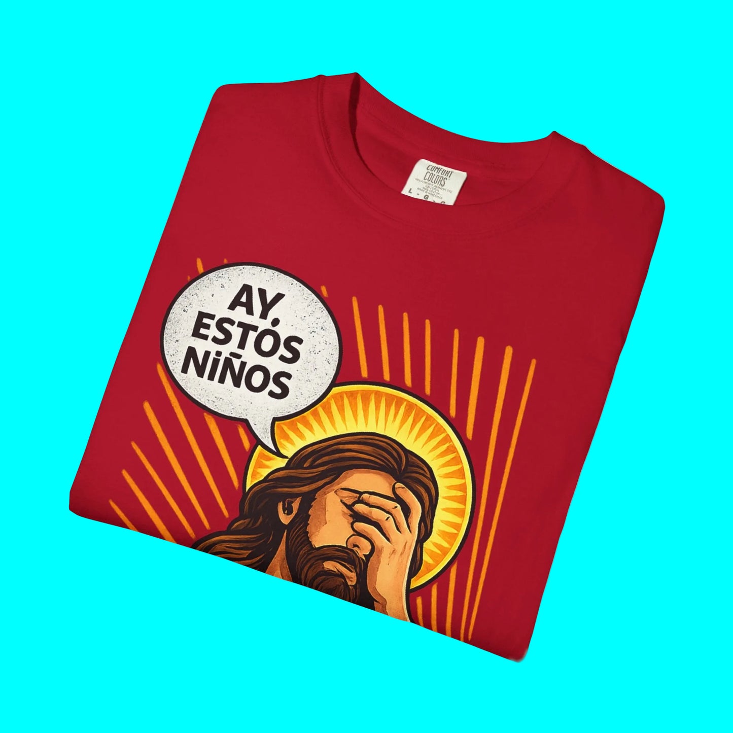 Folded red t-shirt with graphic of a person with a speech bubble and sunburst design on a white background