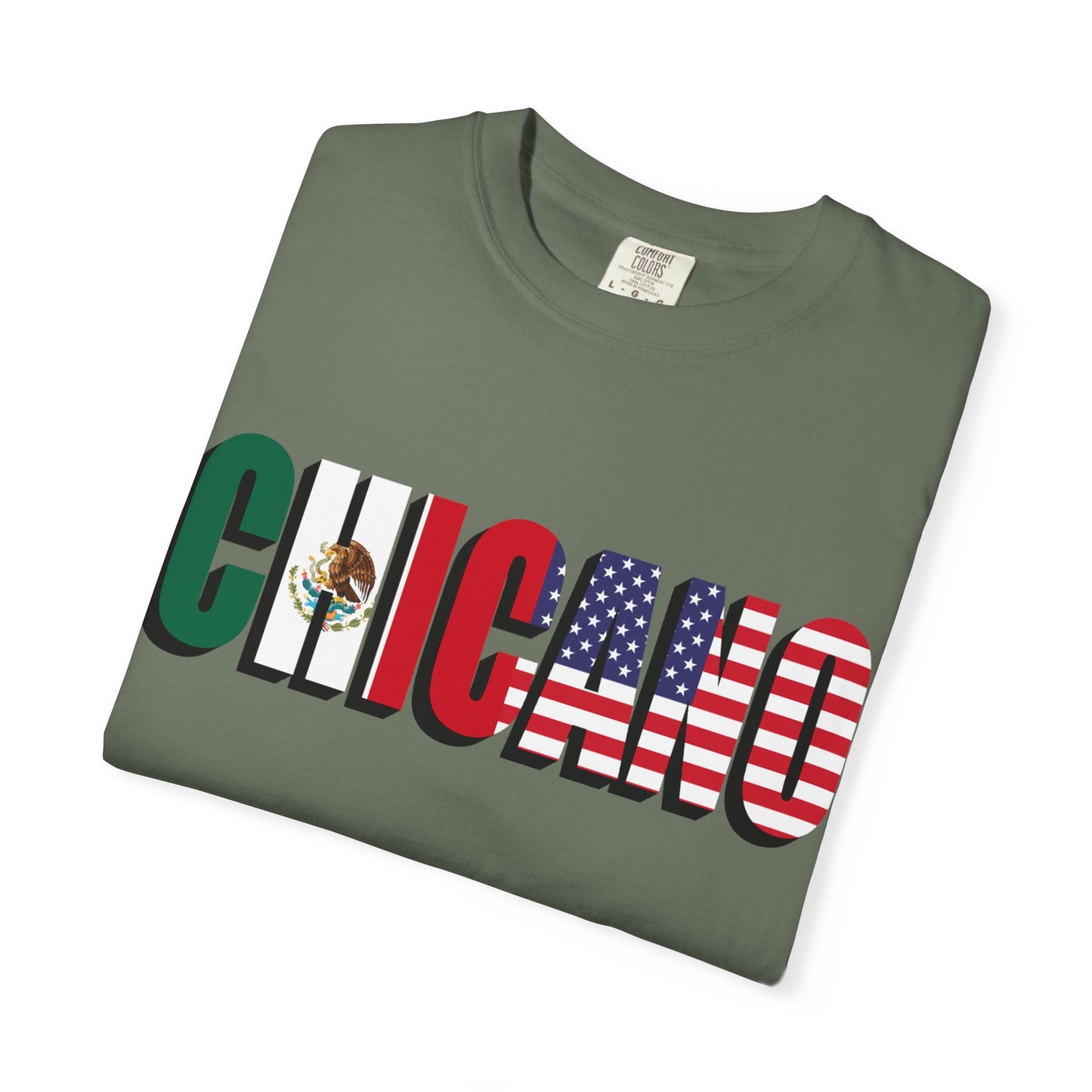 Folded green t-shirt with 'Chicano' text featuring Mexican and American flags on a white background