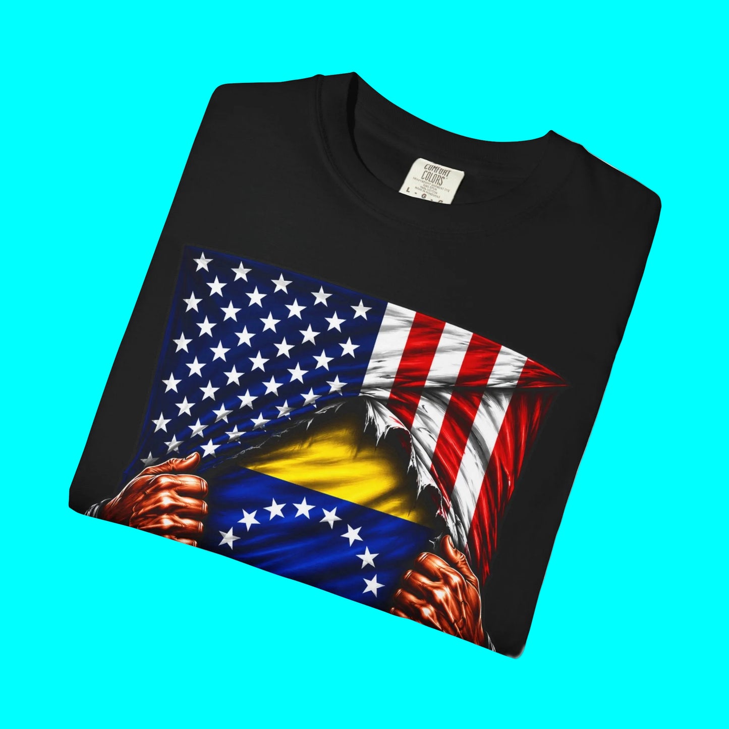 A black short-sleeve t-shirt with a graphic print of a patriotic American flag being ripped open to reveal a yellow and blue flag underneath, with muscular hands tearing the fabric. The shirt is displayed on a clean white background.