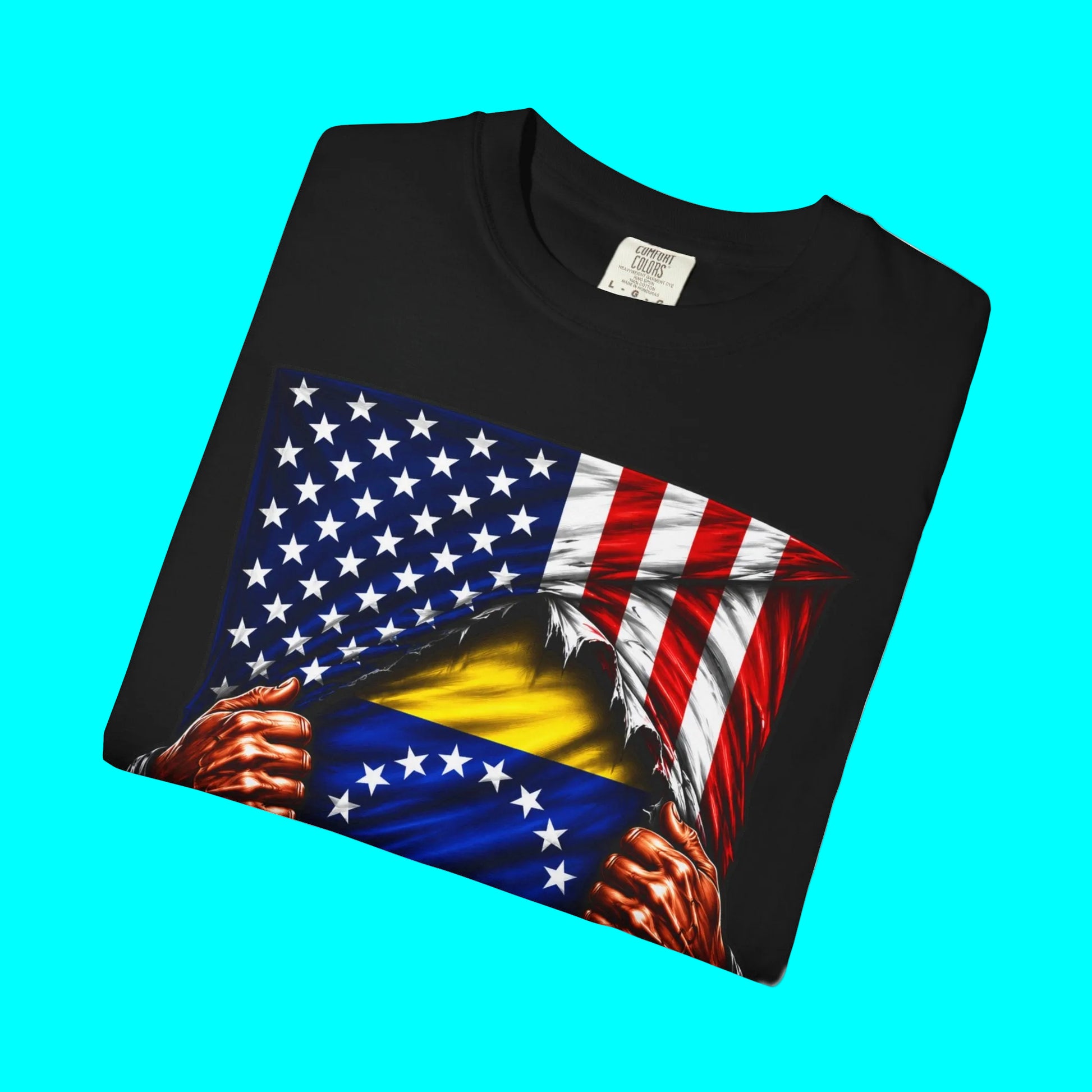 A black short-sleeve t-shirt with a graphic print of a patriotic American flag being ripped open to reveal a yellow and blue flag underneath, with muscular hands tearing the fabric. The shirt is displayed on a clean white background.