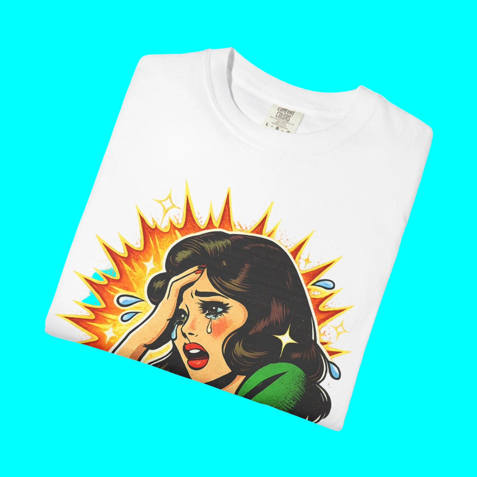White t-shirt with a graphic design of a woman with a shocked expression and a colorful burst on a white background.