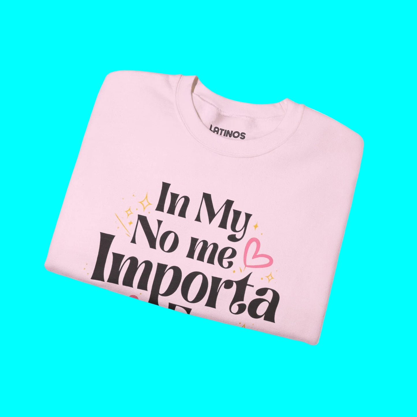 Pink sweatshirt with text 'In My No me Importa' on a white background