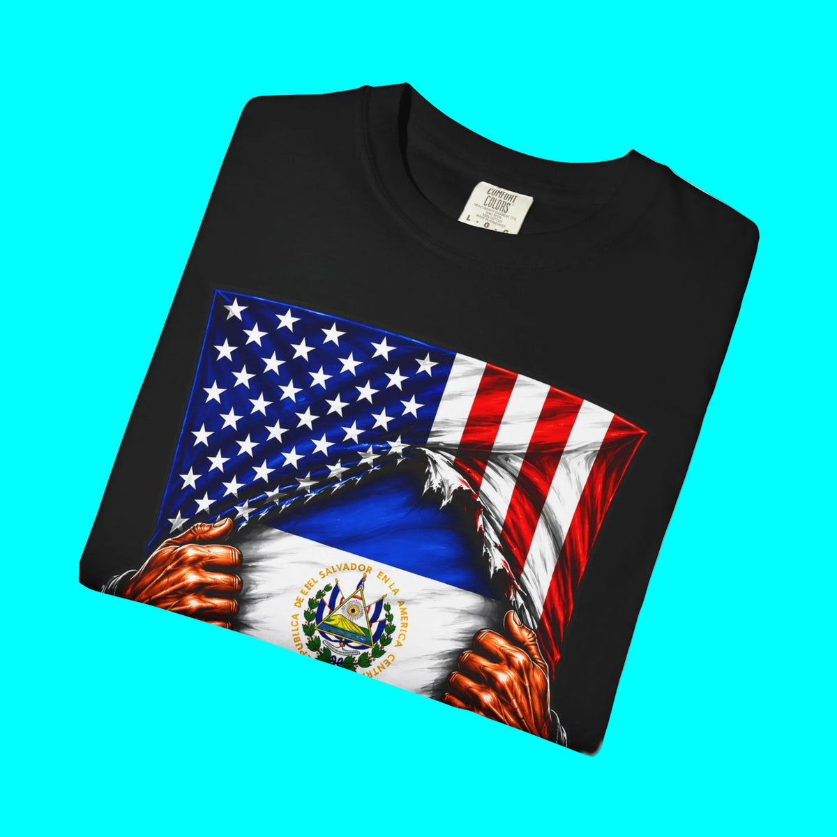 A folded black t-shirt featuring a graphic print of hands tearing apart a United States flag to reveal the flag of Panama underneath, set against a plain white background.