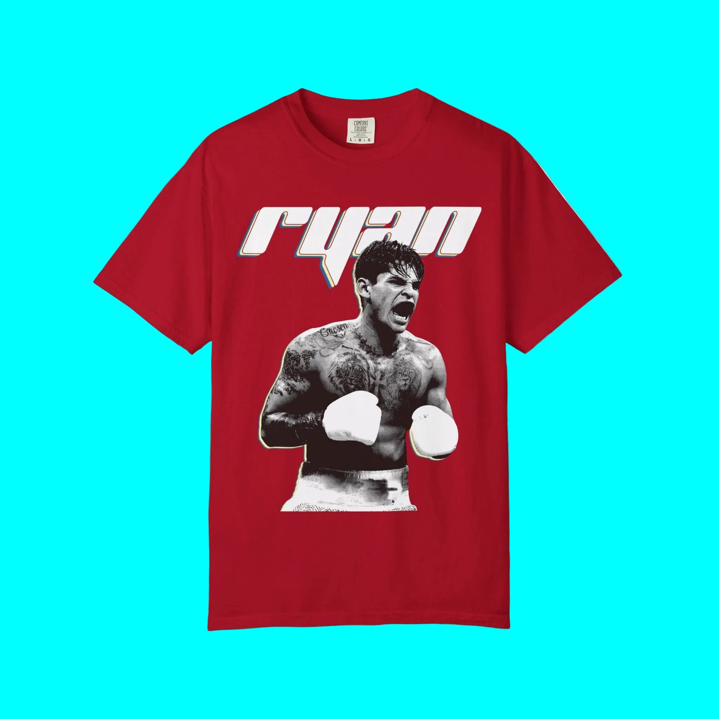 A red short-sleeve t-shirt featuring a graphic print of boxer Ryan Bader on the front, with his name stylized in white and blue outlined letters above the image.