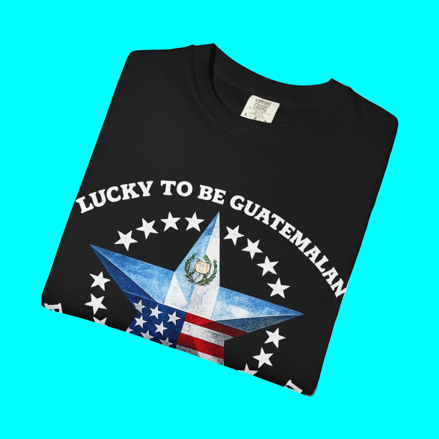 Black t-shirt with a star design and 'Lucky to be Guatemalan' text on a white background