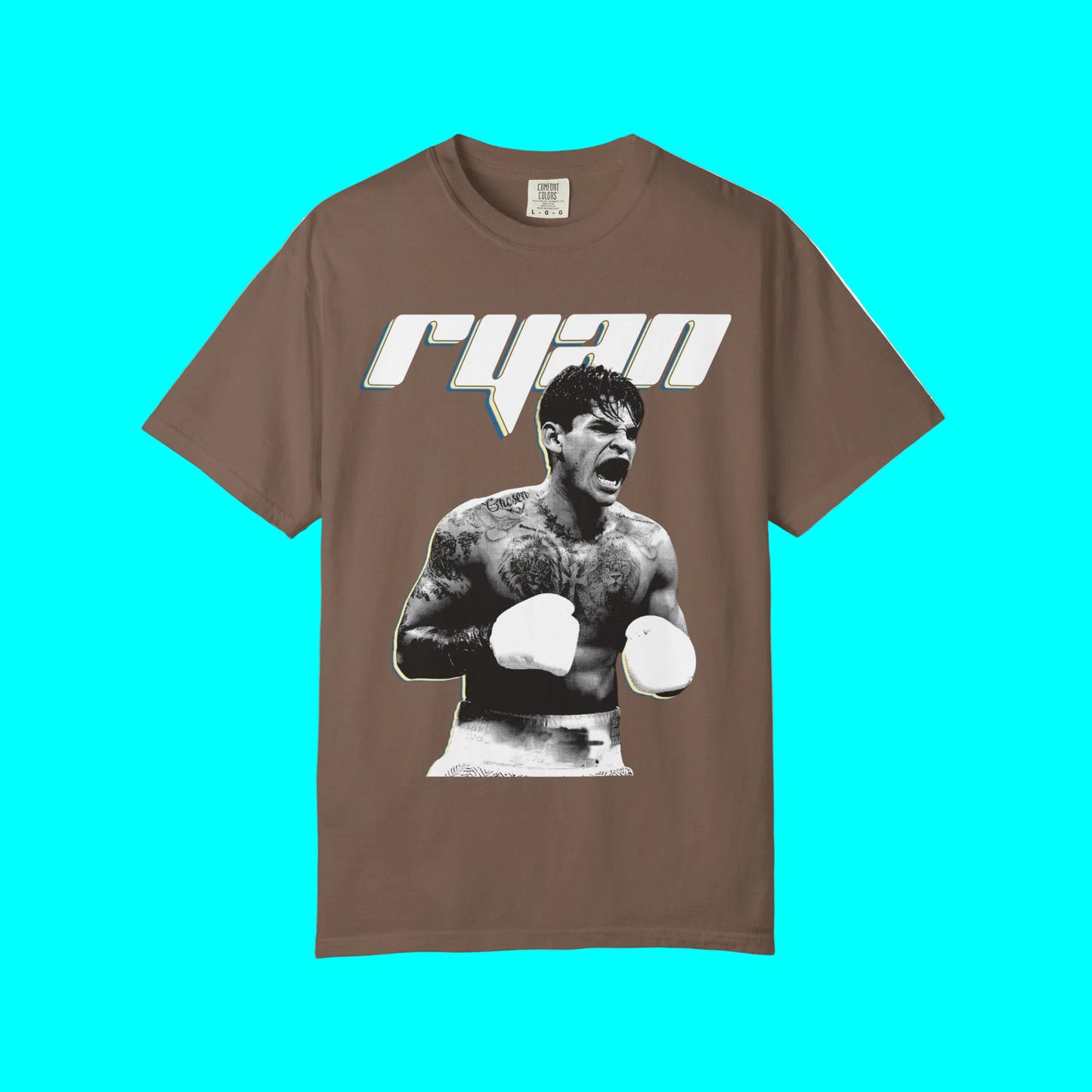 A brown short-sleeve t-shirt featuring a graphic print of a tattooed boxer with white gloves and the name 'RYU' in stylized white and blue lettering above him, displayed on a clean white background.