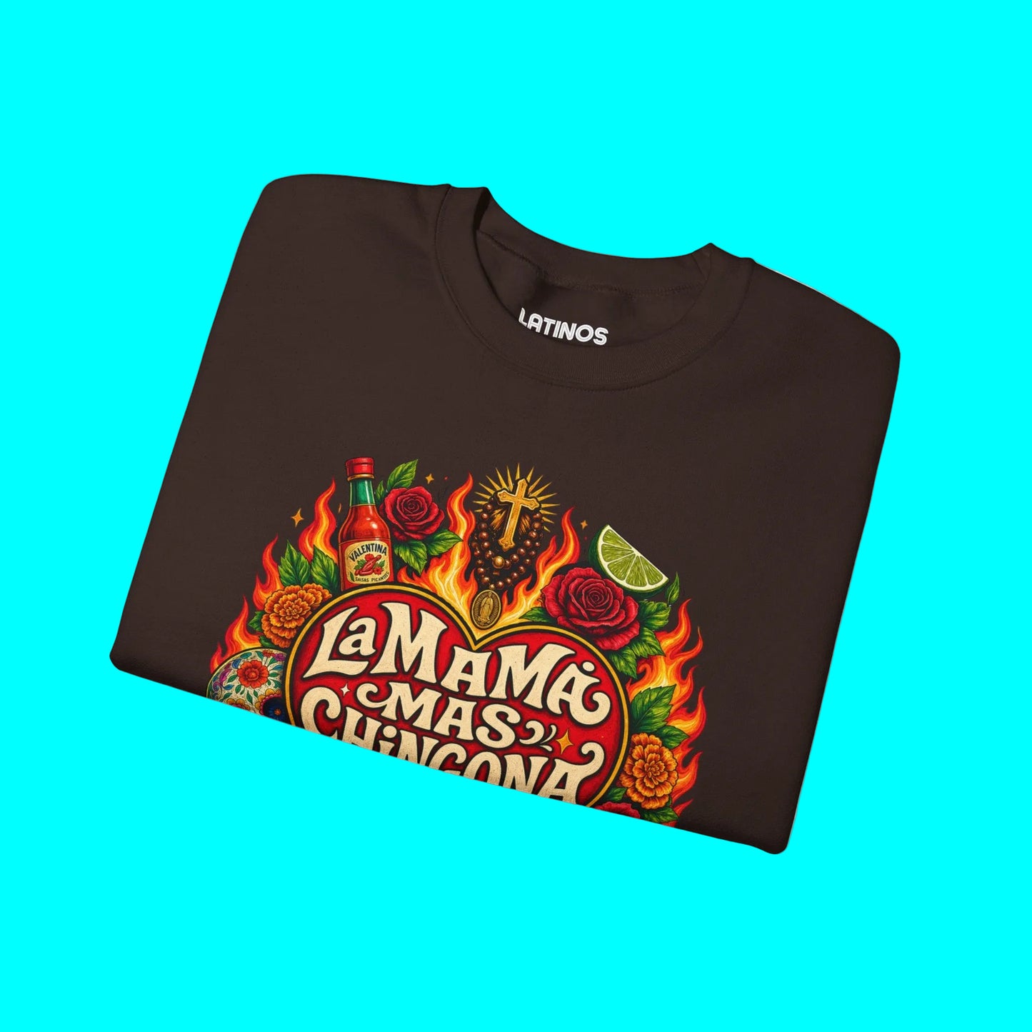 Folded brown sweatshirt with colorful graphic design on a white background