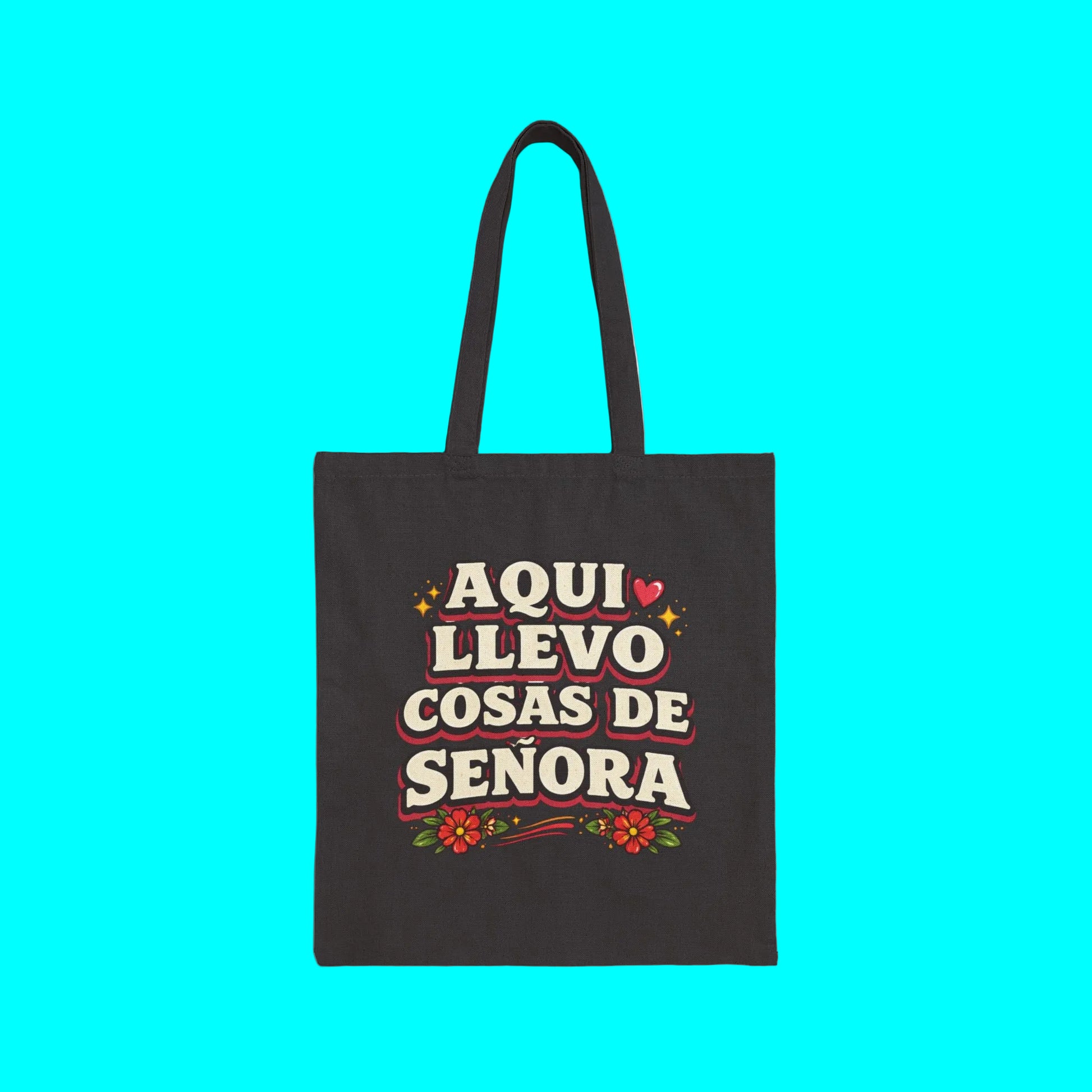 Black tote bag with colorful text and graphics on a white background