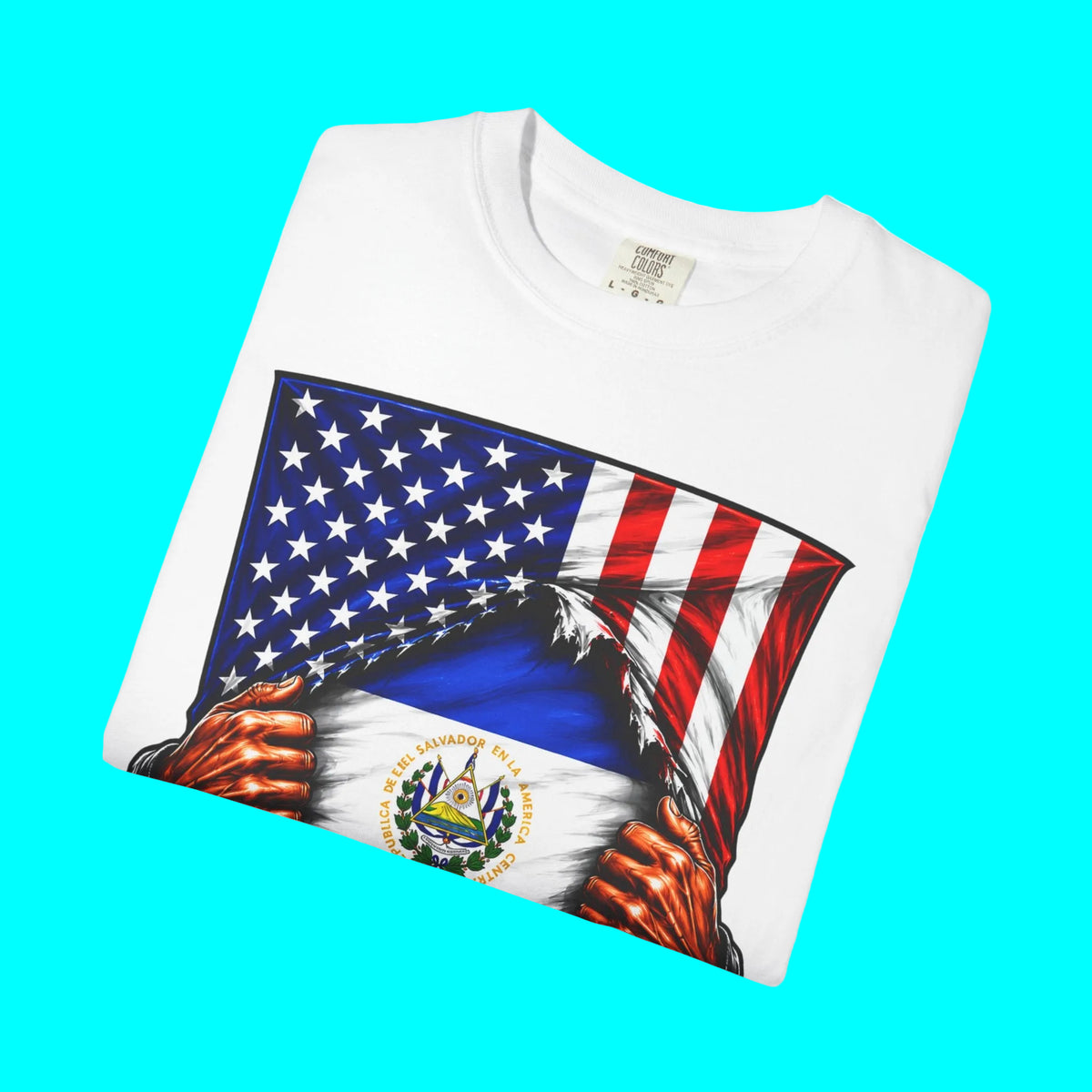 A folded white crewneck t-shirt featuring a graphic print of the United States flag being ripped open to reveal the Haitian flag with its national coat of arms, set against a plain white background.