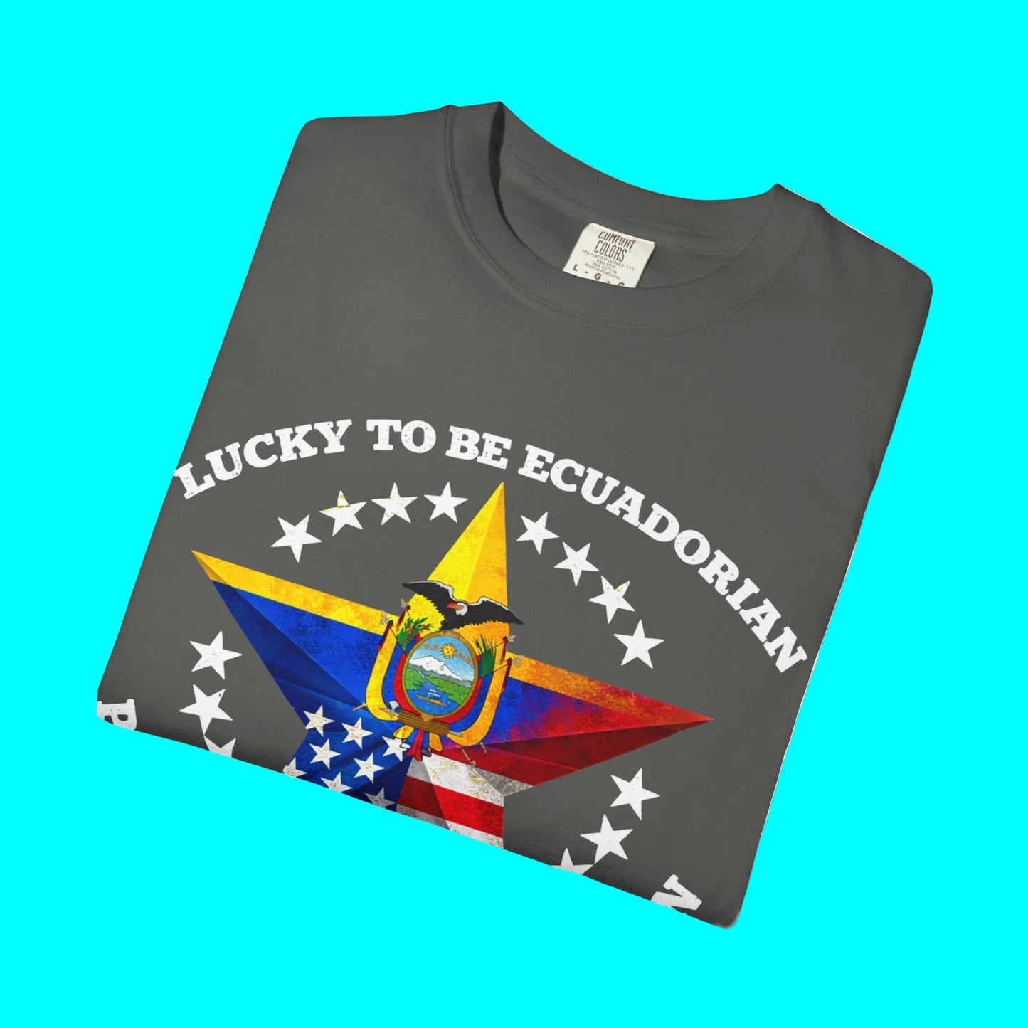 Folded gray t-shirt with 'Lucky to be Ecuadorian' text and flag design on a white background