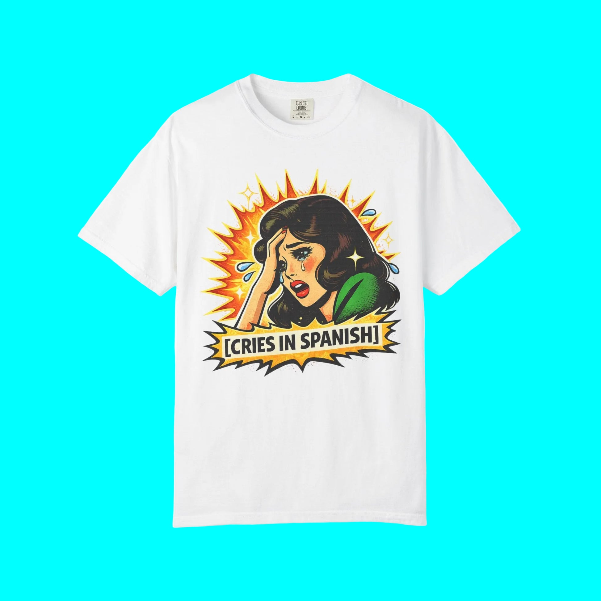 White t-shirt with a graphic design of a woman crying and text 'Cries in Spanish' on a white background.