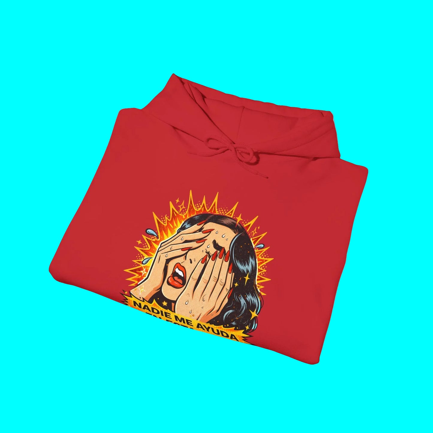 Folded red hoodie with graphic design on a white background