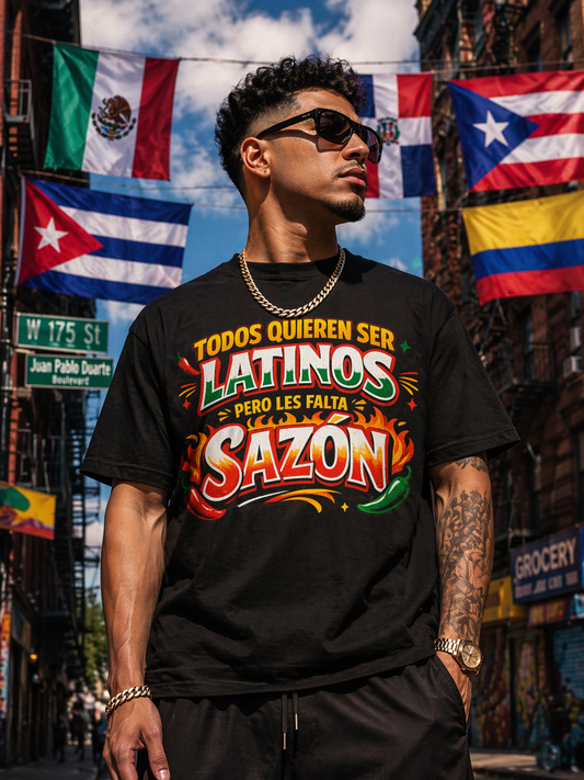 Man wearing a black t-shirt with colorful text in an urban setting with flags in the background
