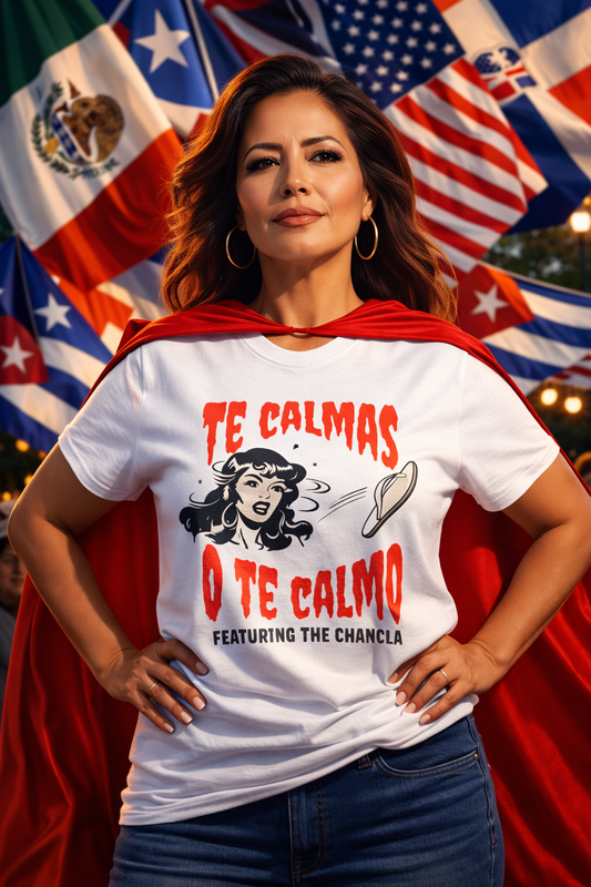 Woman wearing a white t-shirt with text and a red cape in front of American flags.