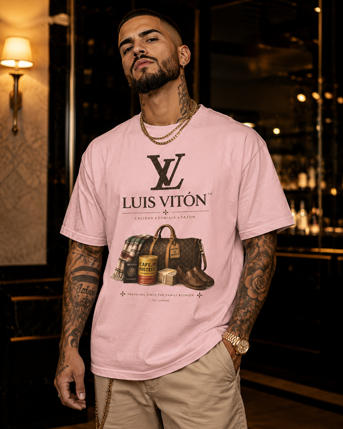 Man wearing a pink Luis Viton t-shirt in an indoor setting