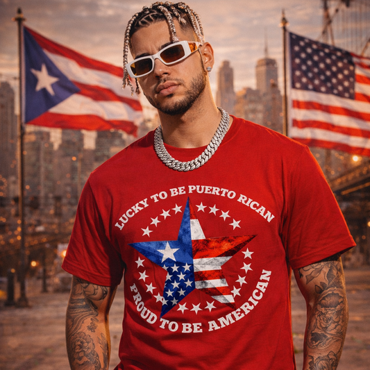Man wearing a red t-shirt with a patriotic design in front of American and Puerto Rican flags.