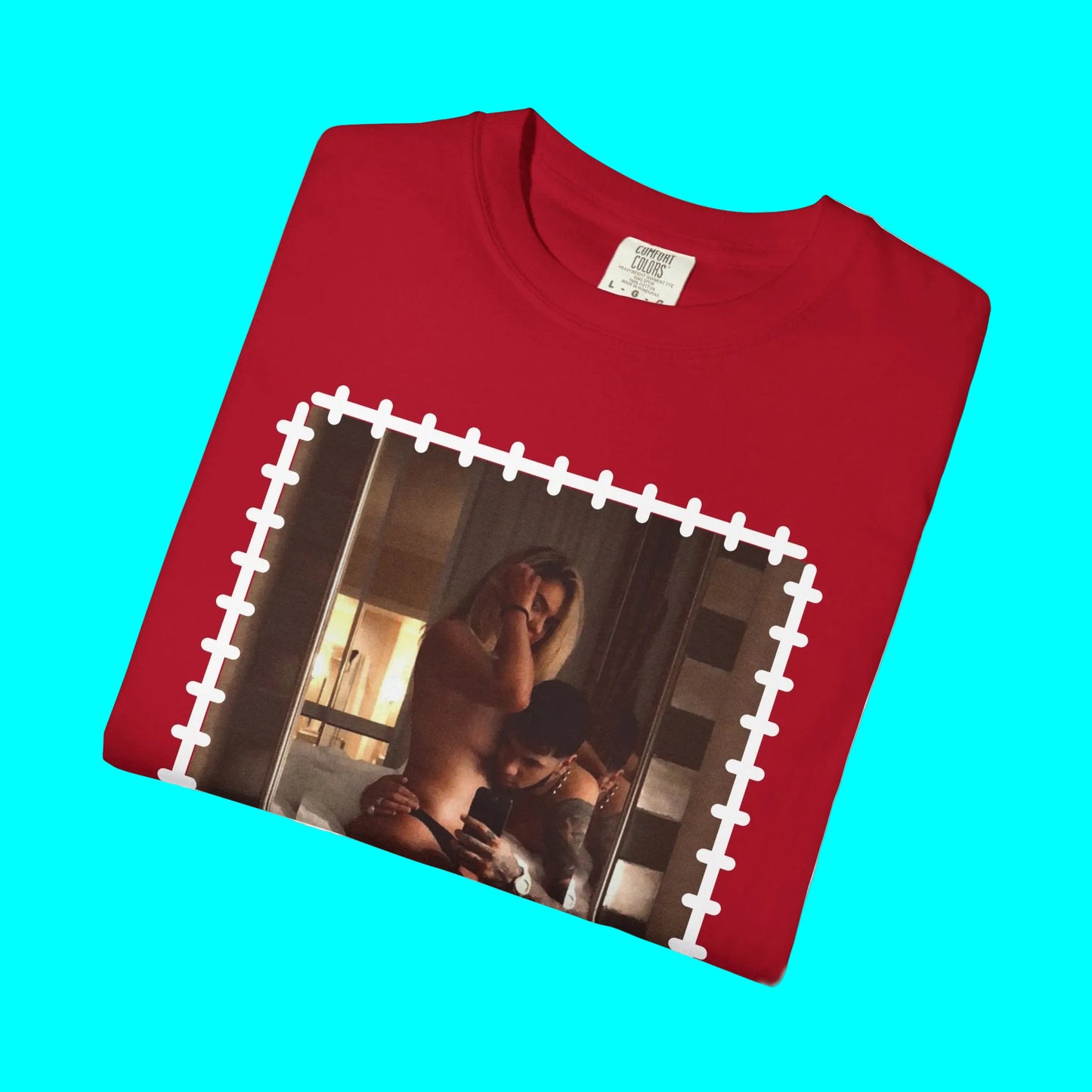 Folded red t-shirt with a graphic design on a white background