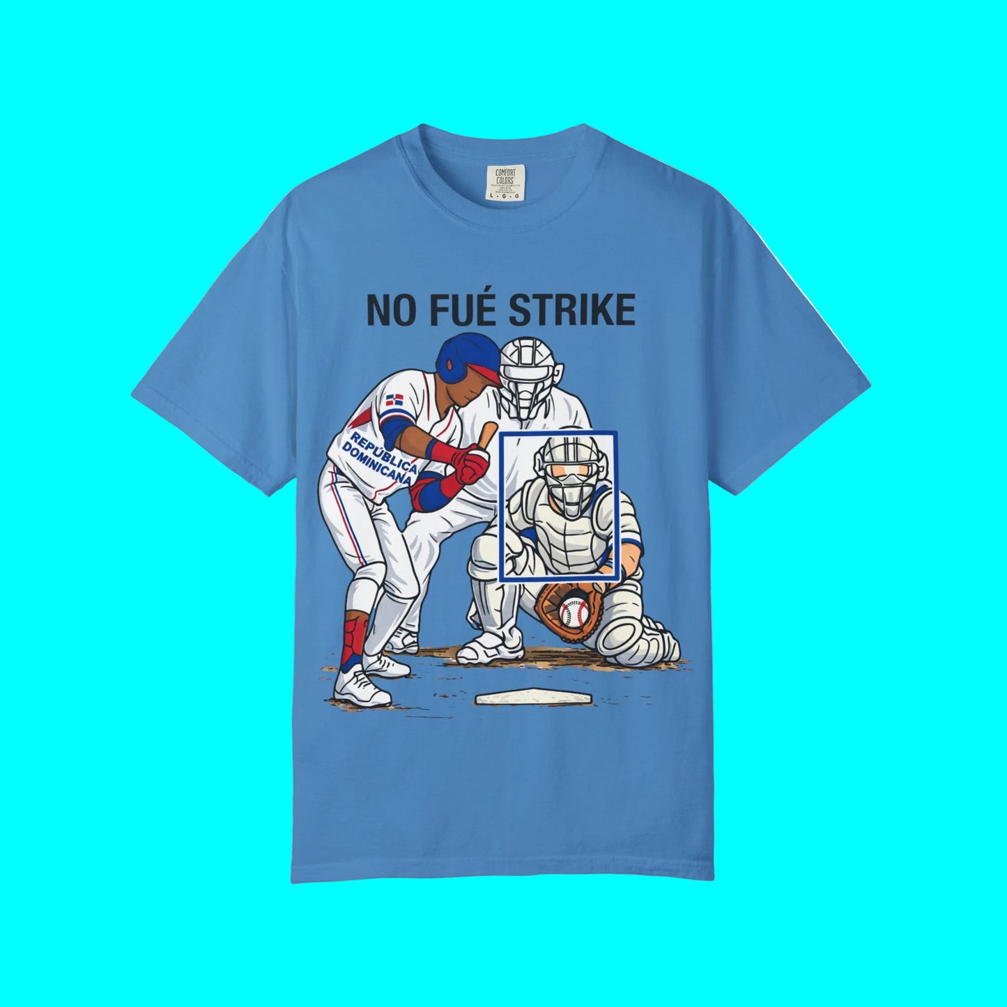 Blue t-shirt with a graphic of a baseball player and catcher, and text 'NO FUñE STRIKE' on a white background.