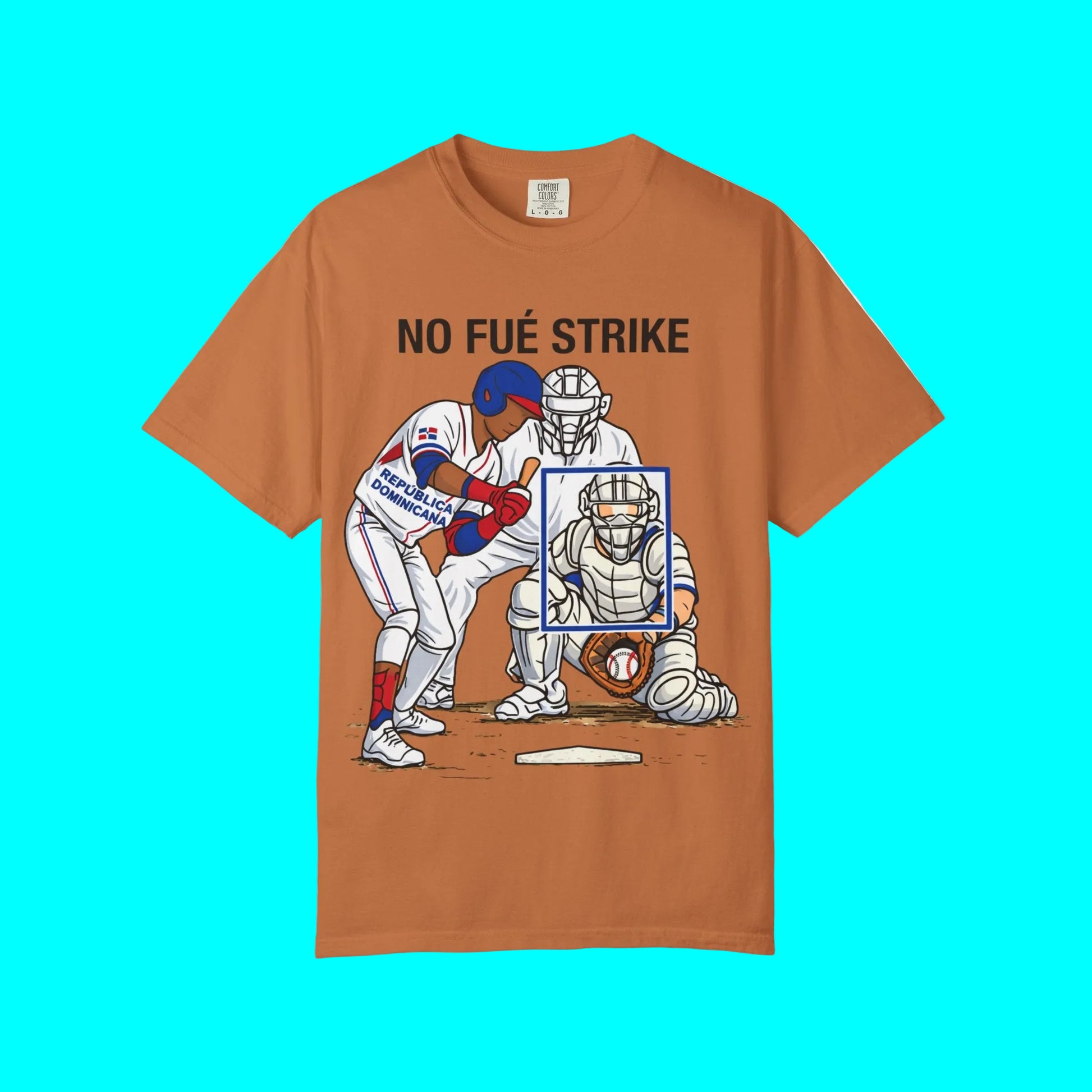 Brown t-shirt with a graphic of a baseball player and catcher and text 'NO FUÓ STRIKE' on a white background.
